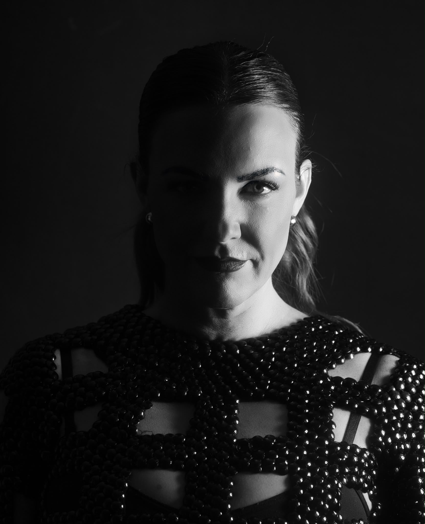 Leccy in a dramatic black-and-white portrait